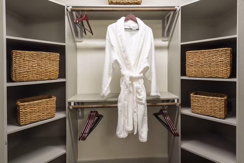 Walk-in closet with abundant storage space in 1414 Texas Downtown Apartments
