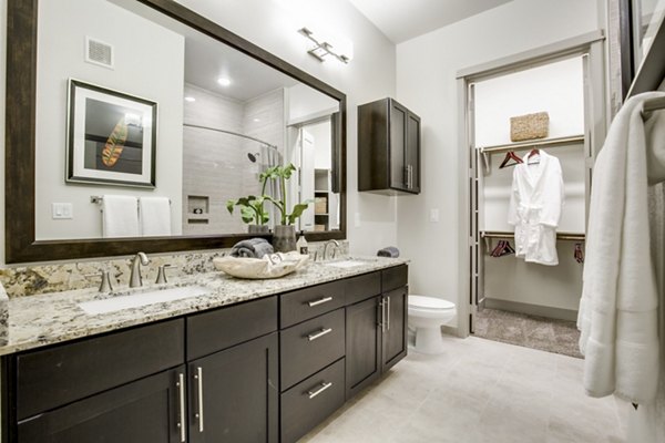 Luxurious bathroom with modern fixtures at 1414 Texas Downtown Apartments