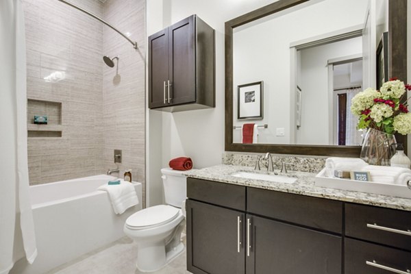 Luxurious bathroom with contemporary fixtures at 1414 Texas Downtown Apartments in Houston