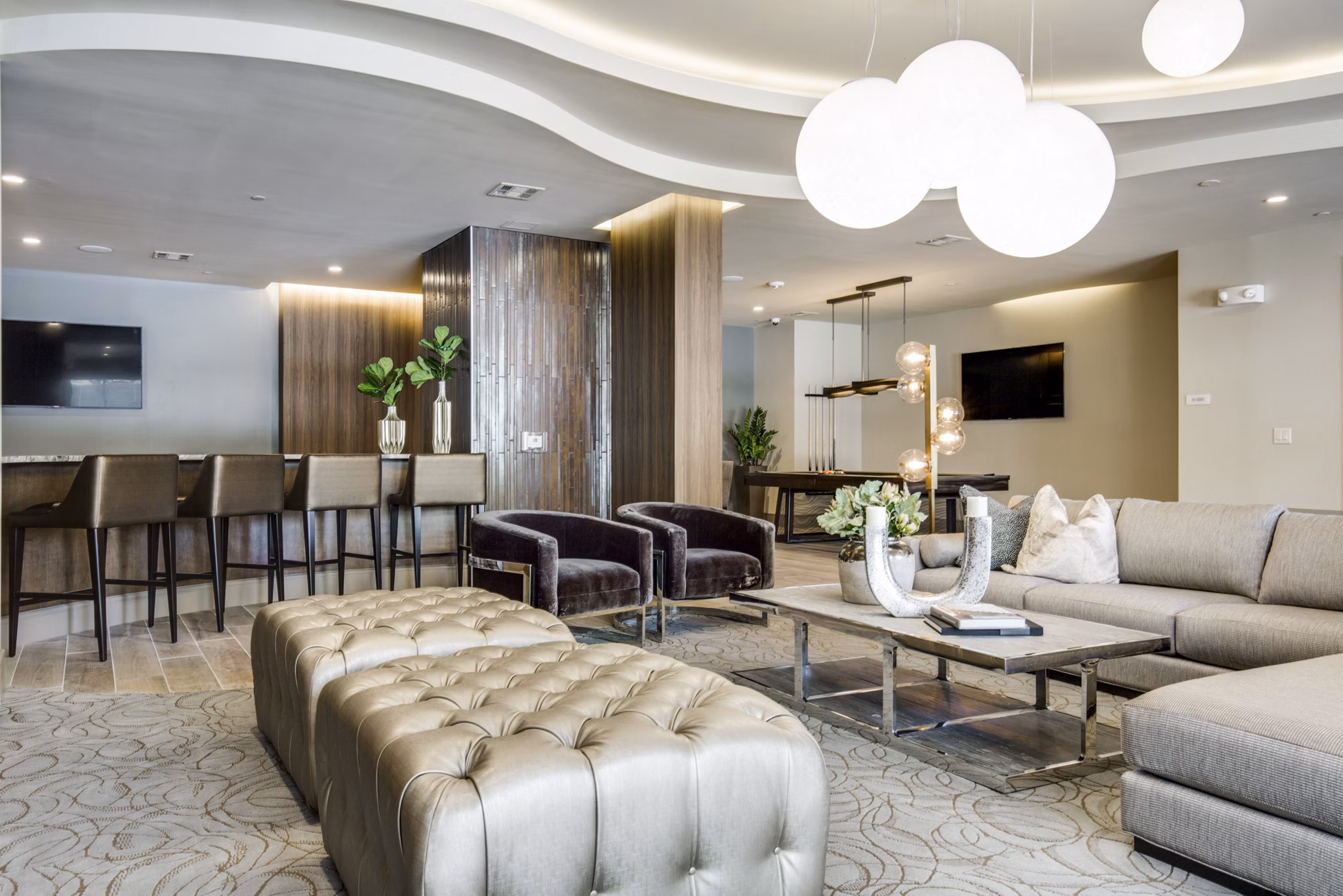 Modern clubhouse with stylish seating area at 1414 Texas Downtown Apartments, featuring luxury amenities and vibrant decor for social gatherings