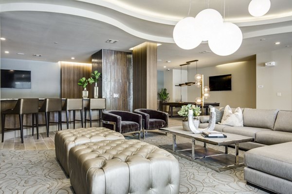 Modern clubhouse with stylish seating area at 1414 Texas Downtown Apartments, featuring luxury amenities and vibrant decor for social gatherings