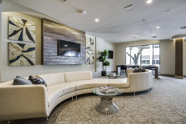 Clubhouse featuring modern lounge and game room at 1414 Texas Downtown Apartments in vibrant urban setting
