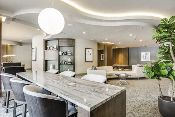Modern clubhouse with stylish seating and vibrant decor at 1414 Texas Downtown Apartments