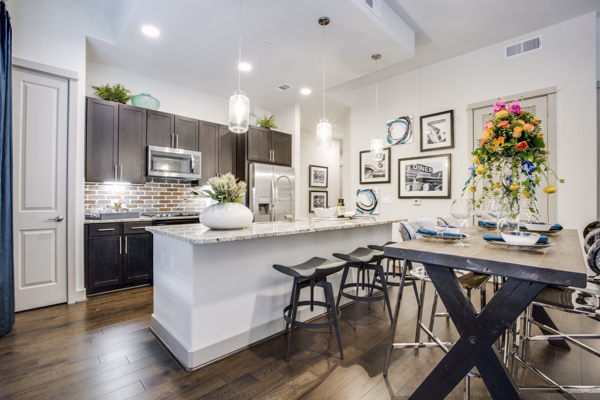 Dining room featuring modern decor and pendant lighting at 1414 Texas Downtown Apartments, luxury living in the heart of the city