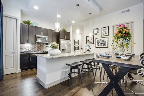 Dining room featuring modern decor and pendant lighting at 1414 Texas Downtown Apartments, luxury living in the heart of the city