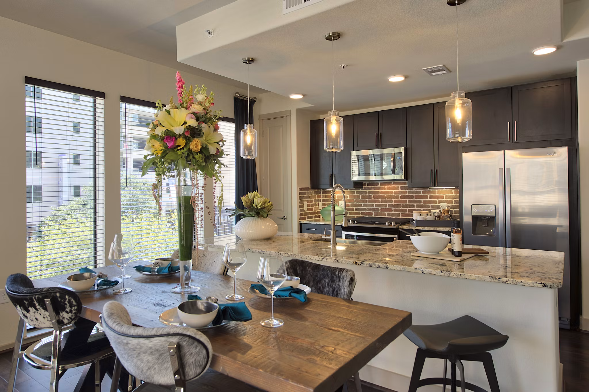 Dining room with modern lighting and stylish furnishings at 1414 Texas Downtown Apartments