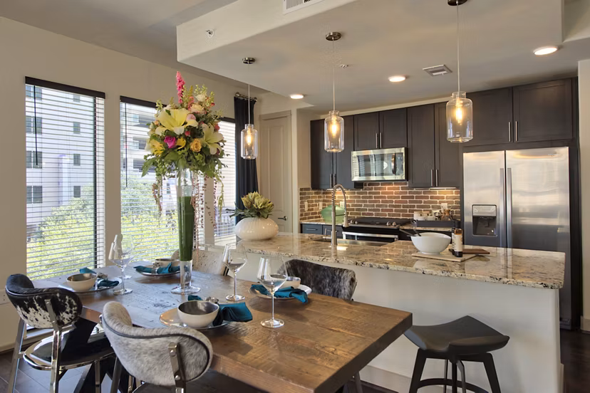 Dining room with modern lighting and stylish furnishings at 1414 Texas Downtown Apartments