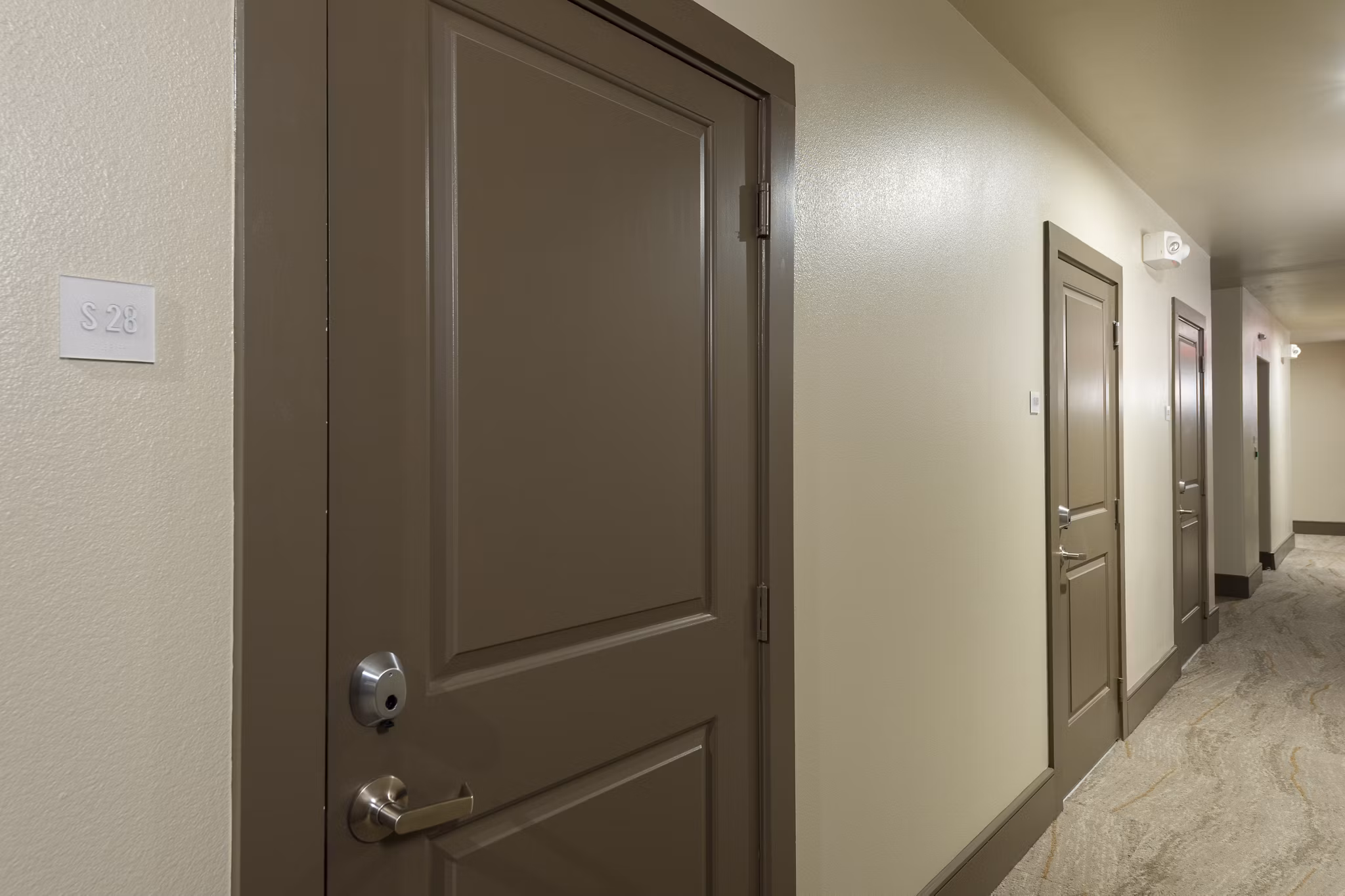 Contemporary hallway with modern lighting at 1414 Texas Downtown Apartments