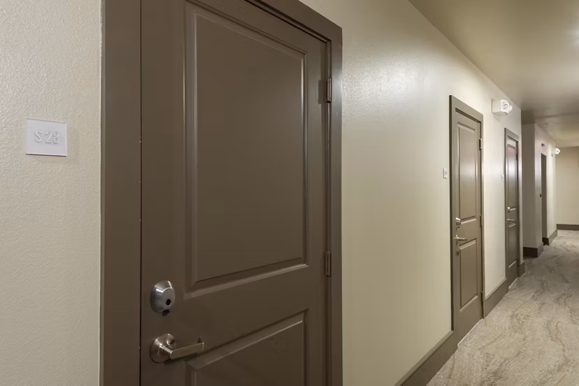 Contemporary hallway with modern lighting at 1414 Texas Downtown Apartments