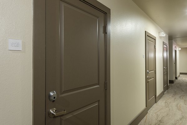 Contemporary hallway with modern lighting at 1414 Texas Downtown Apartments