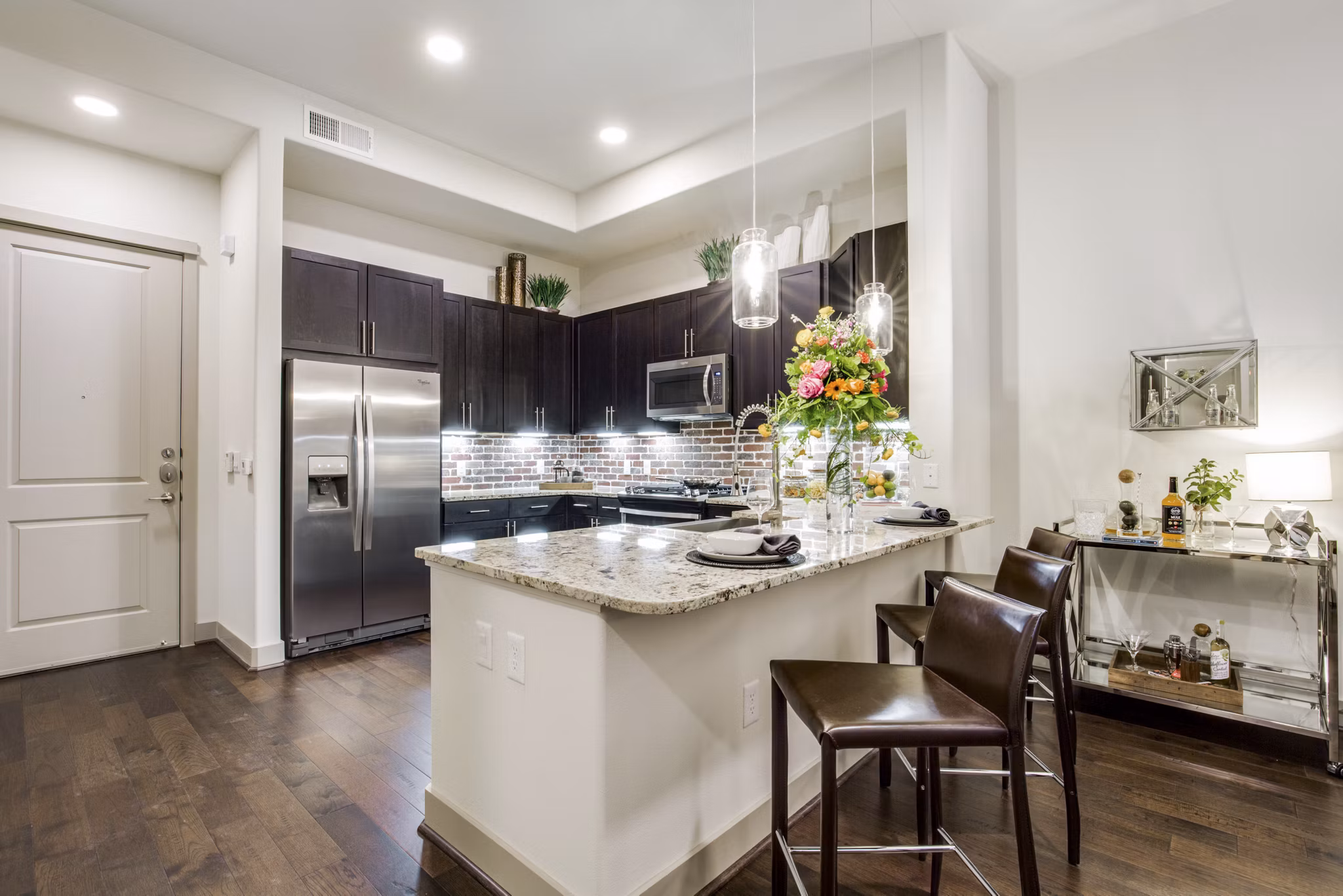 Modern kitchen with stainless steel appliances at 1414 Texas Downtown Apartments Perfect blend of style and functionality in luxury living