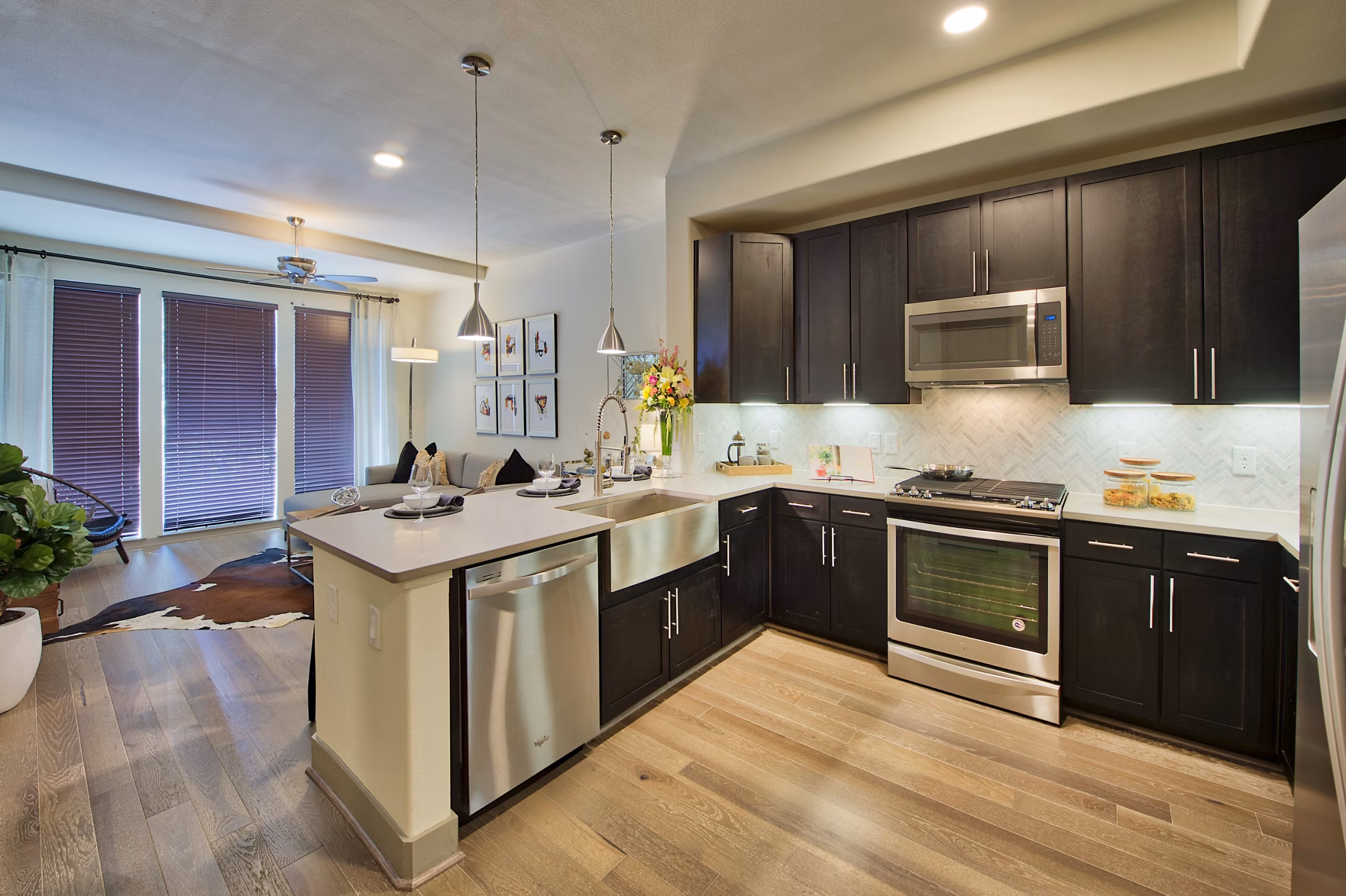 Modern kitchen with sleek cabinets and stainless steel appliances at 1414 Texas Downtown Apartments