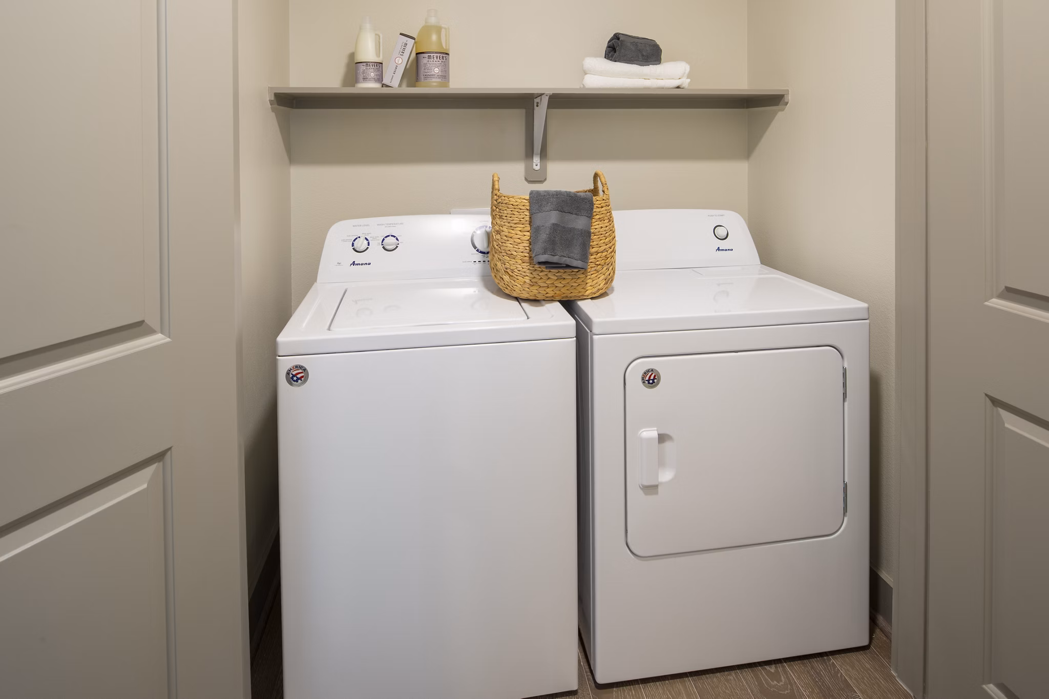 Laundry room featuring modern appliances at 1414 Texas Downtown Apartments
