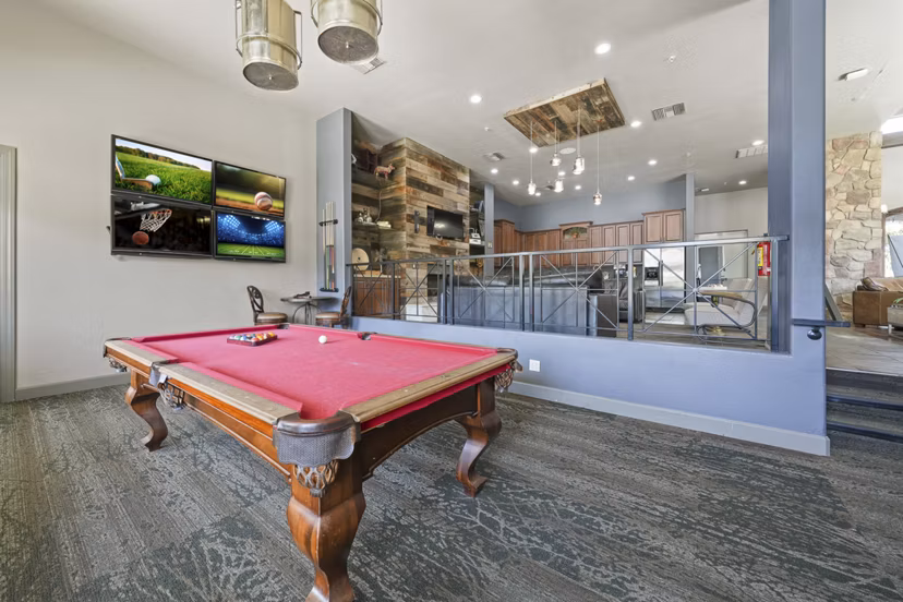 Clubhouse with elegant seating and modern design at Bella Mirage Apartments, ideal for social gatherings and luxury living experiences