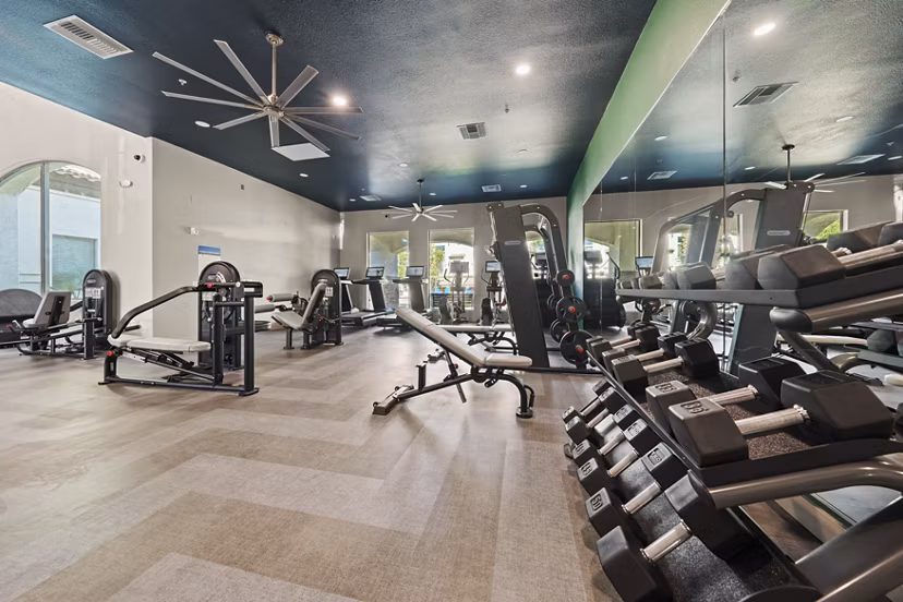 Fitness center with modern equipment at Bella Mirage Apartments