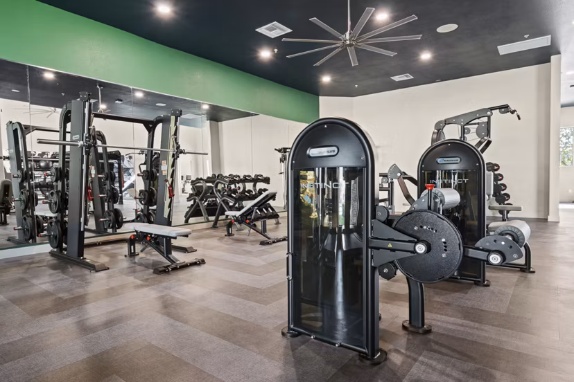 Modern fitness center with state-of-the-art equipment at Bella Mirage Apartments for active living enthusiasts