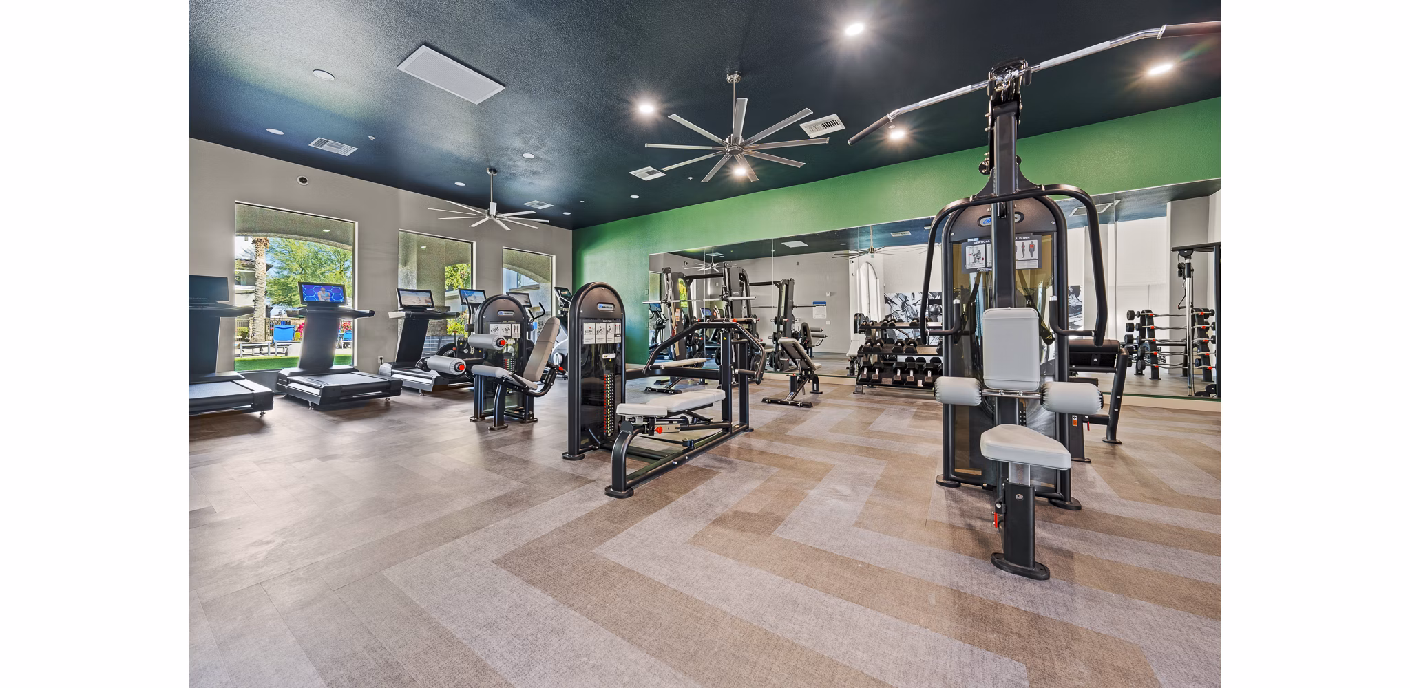 Modern fitness center with state-of-the-art equipment at Bella Mirage Apartments for active living enthusiasts