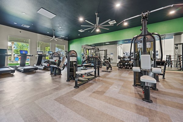 Modern fitness center with state-of-the-art equipment at Bella Mirage Apartments for active living enthusiasts