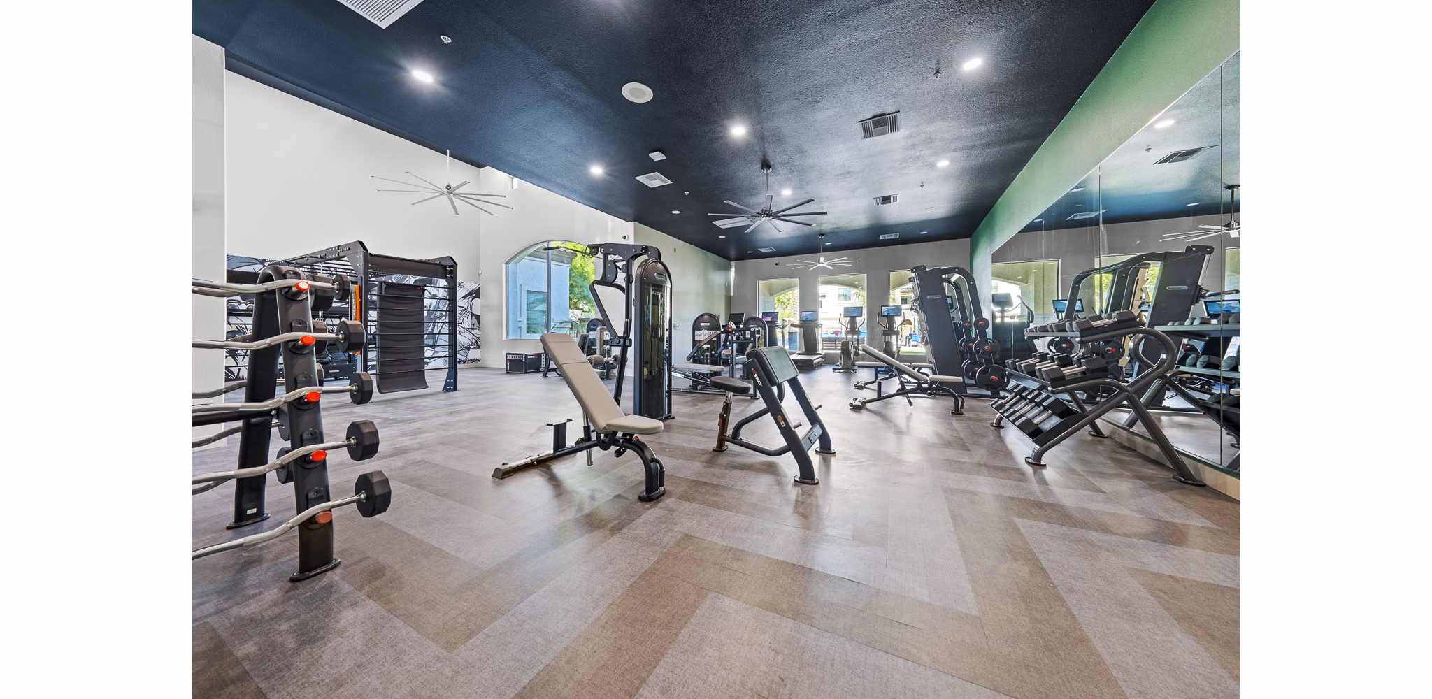 Fitness center with modern equipment at Bella Mirage Apartments