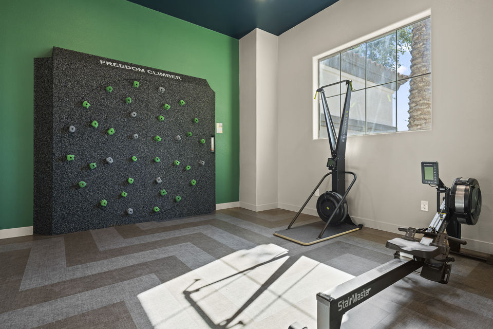 Fitness center with modern equipment at Bella Mirage Apartments