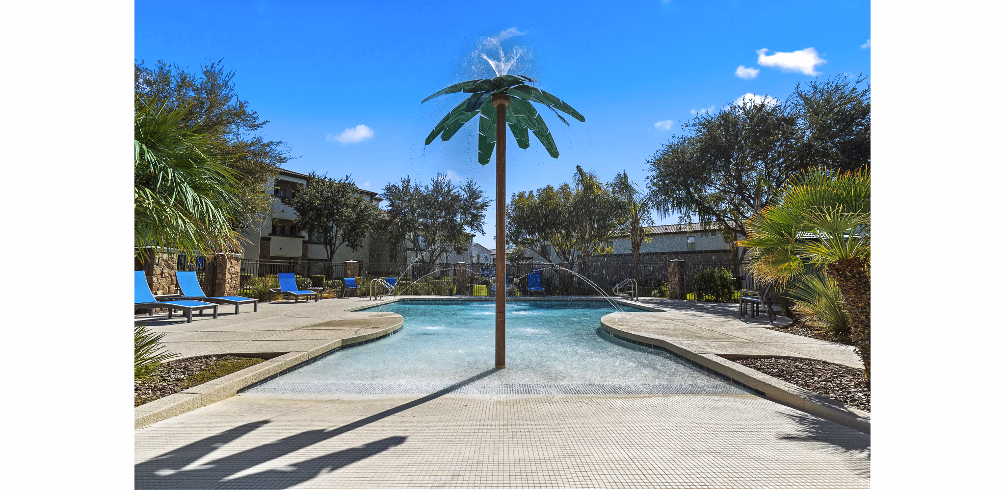 Infinity-edge pool at Bella Mirage Apartments featuring luxurious poolside cabanas for ultimate relaxation