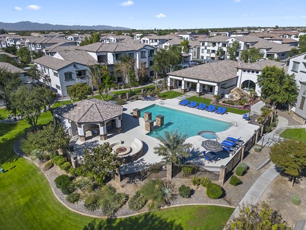 Pool at Bella Mirage Apartments: Luxurious resort-style pool with lounge areas, perfect for relaxation and social gatherings