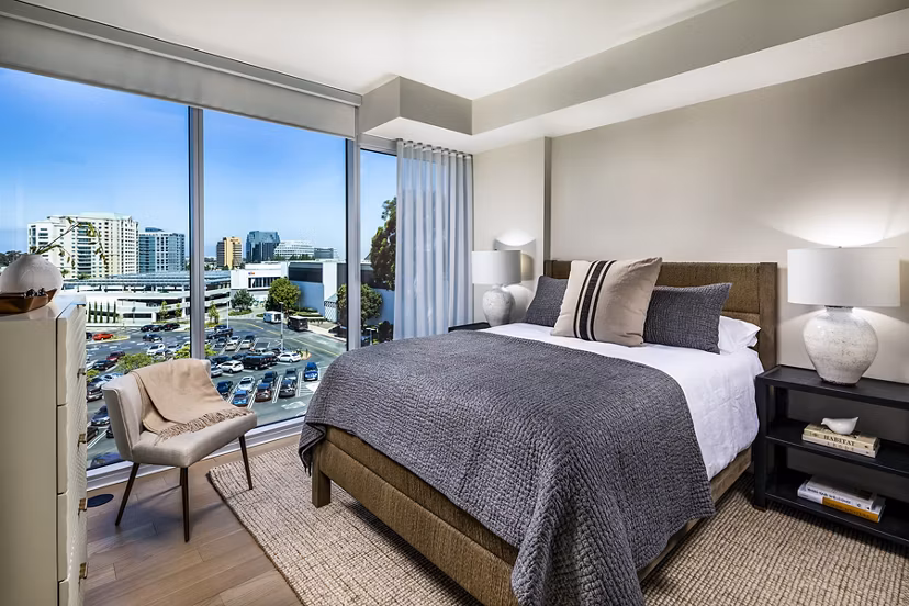 Luxurious bedroom with modern decor at Palisade at Westfield UTC Apartments, featuring cozy bedding and stylish furniture in San Diego