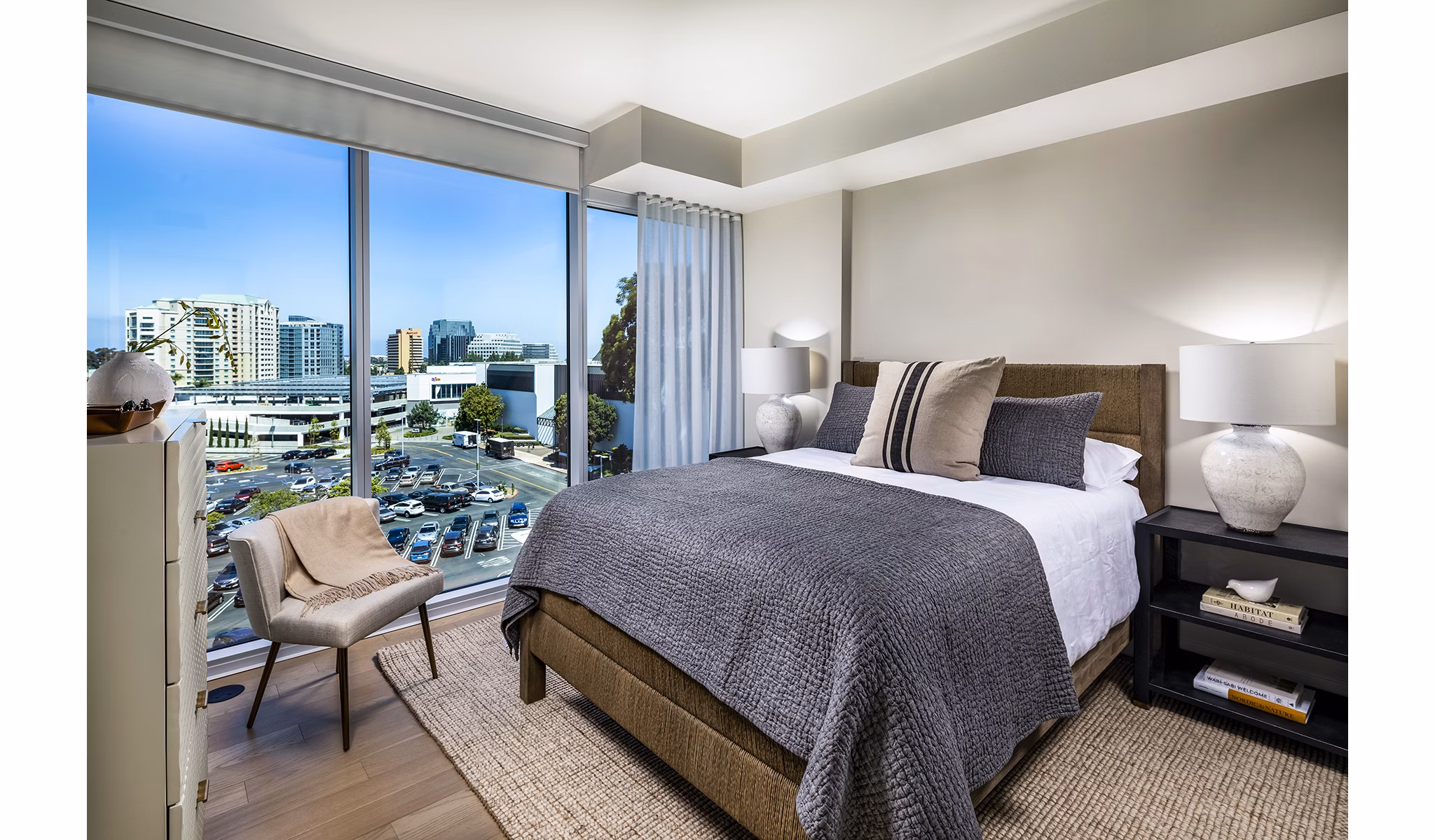 Luxurious bedroom with modern decor at Palisade at Westfield UTC Apartments, featuring cozy bedding and stylish furniture in San Diego