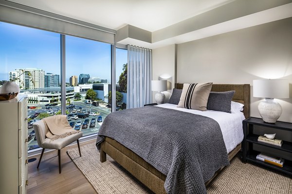 Luxurious bedroom with modern decor at Palisade at Westfield UTC Apartments, featuring cozy bedding and stylish furniture in San Diego