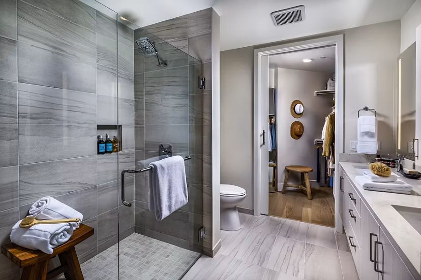 Luxurious bathroom with modern fixtures at Palisade at Westfield UTC Apartments, offering comfort and style in every detail