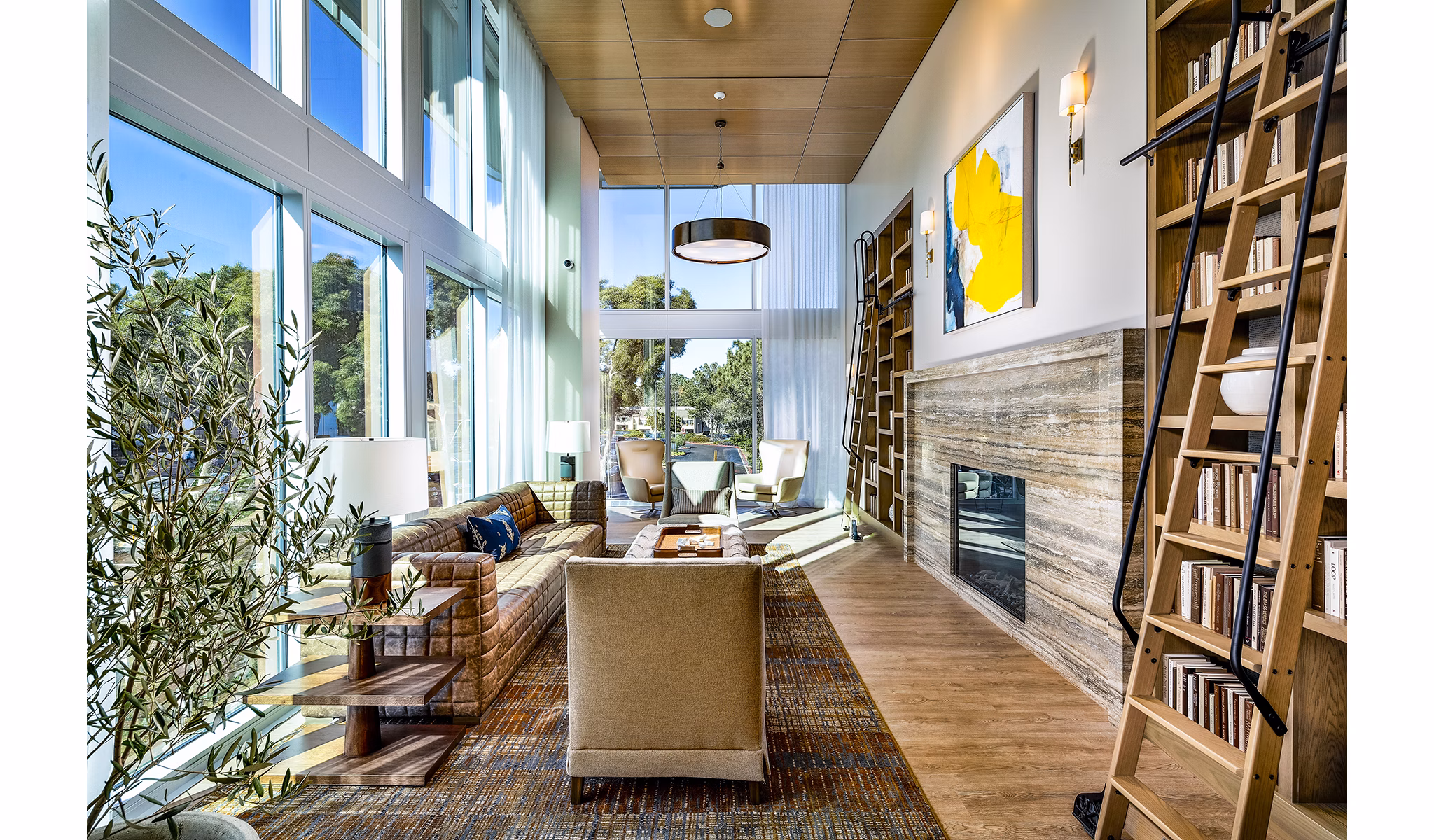 Clubhouse featuring modern design and spacious seating at Palisade at Westfield UTC Apartments