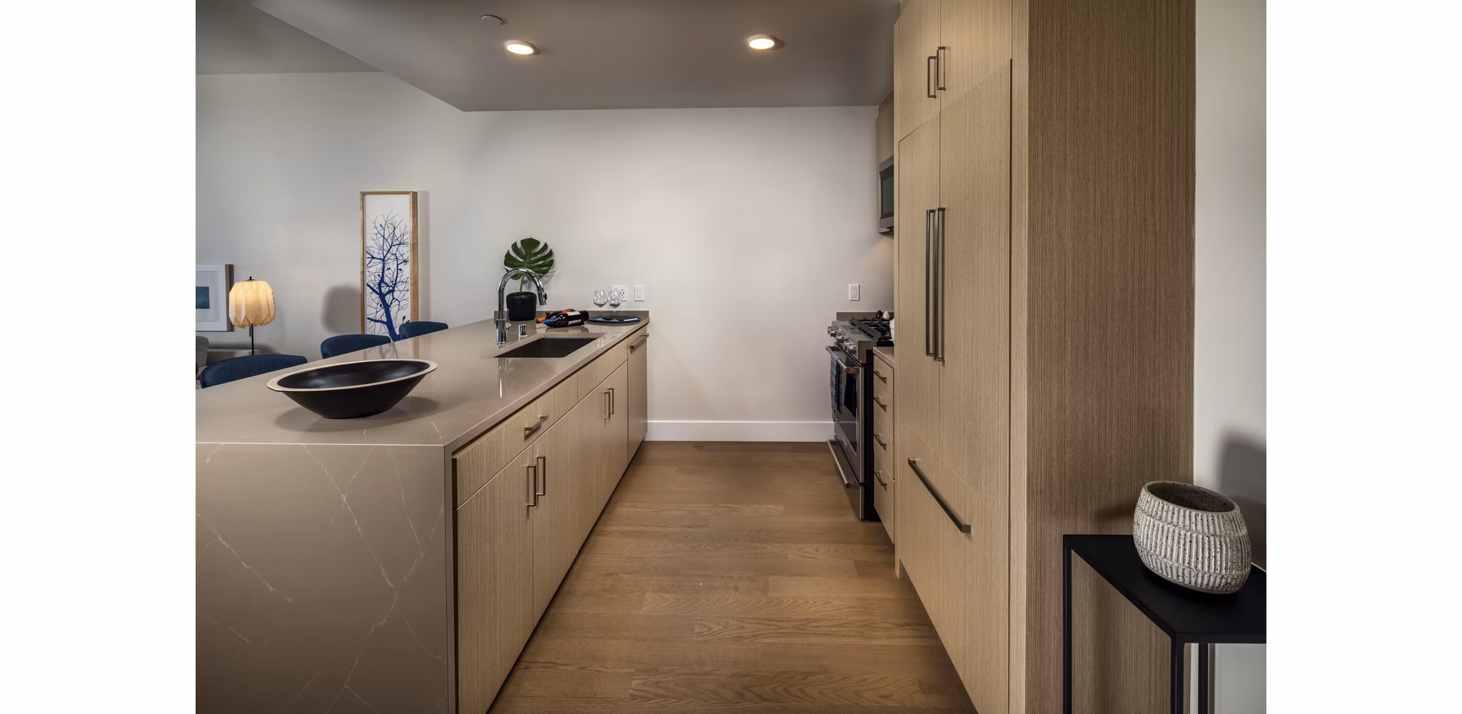 Modern kitchen with stainless steel appliances at Palisade at Westfield UTC Apartments, offering luxury living in a prime location