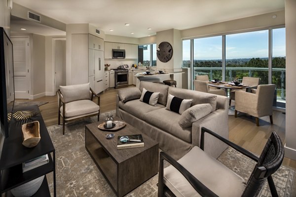 Spacious living room with modern furnishings at Palisade at Westfield UTC Apartments, offering luxury living in San Diego