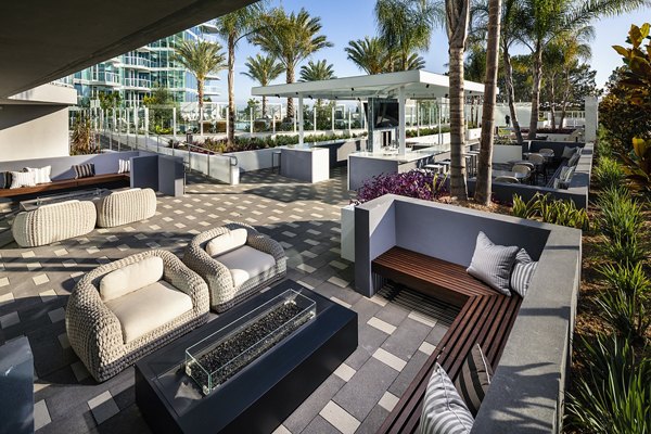 Palisade at Westfield UTC: Modern patio with comfortable seating and lush landscaping for luxury living