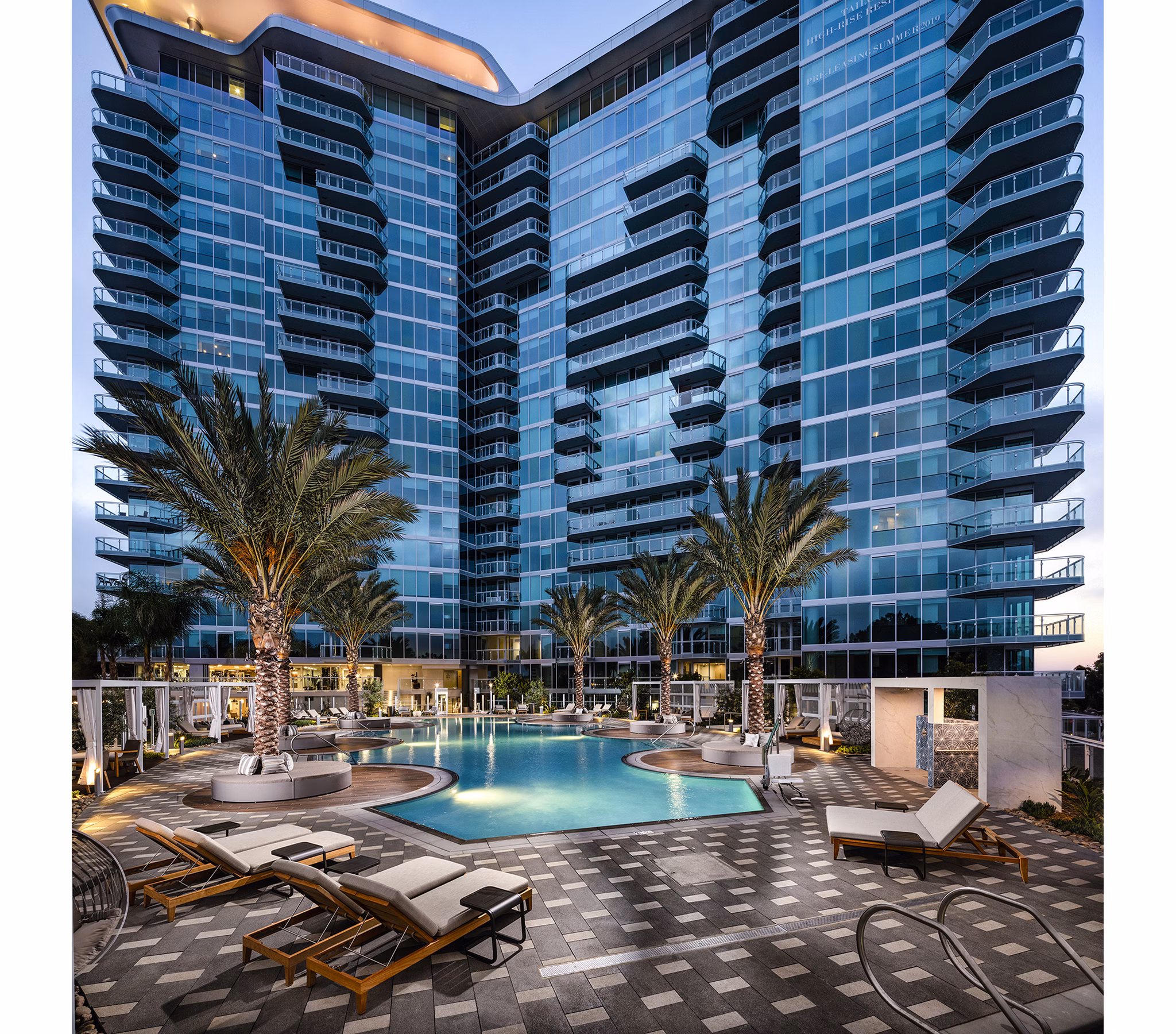 Resort-style pool with lounge chairs at Palisade at Westfield UTC Apartments, offering luxurious living in a vibrant community setting