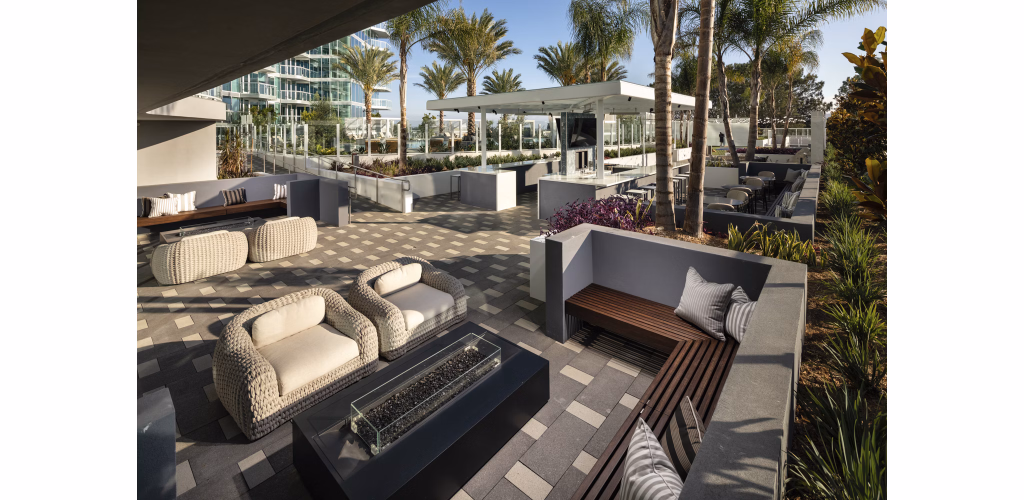 Outdoor seating with fire pit at Palisade at Westfield UTC Apartments, perfect for luxury relaxation