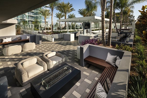 Outdoor seating with fire pit at Palisade at Westfield UTC Apartments, perfect for luxury relaxation