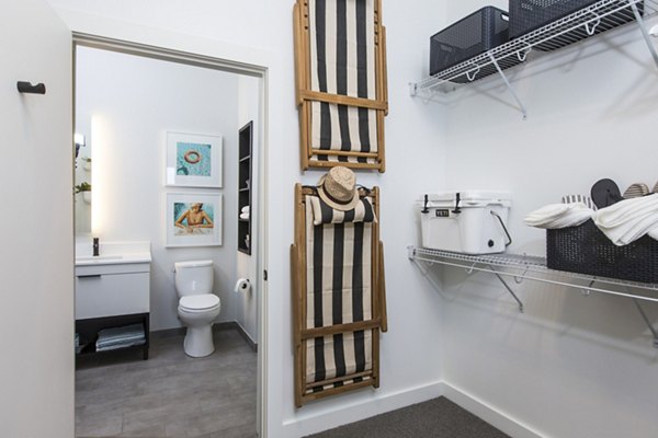 Walk-in closet and modern bathroom at 500 Ocean Ave Apartments, featuring luxury finishes in a serene living space