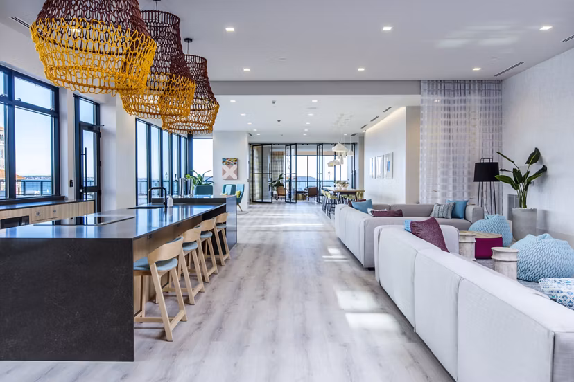 Clubhouse kitchen with sleek countertops and modern appliances at 500 Ocean Ave Apartments