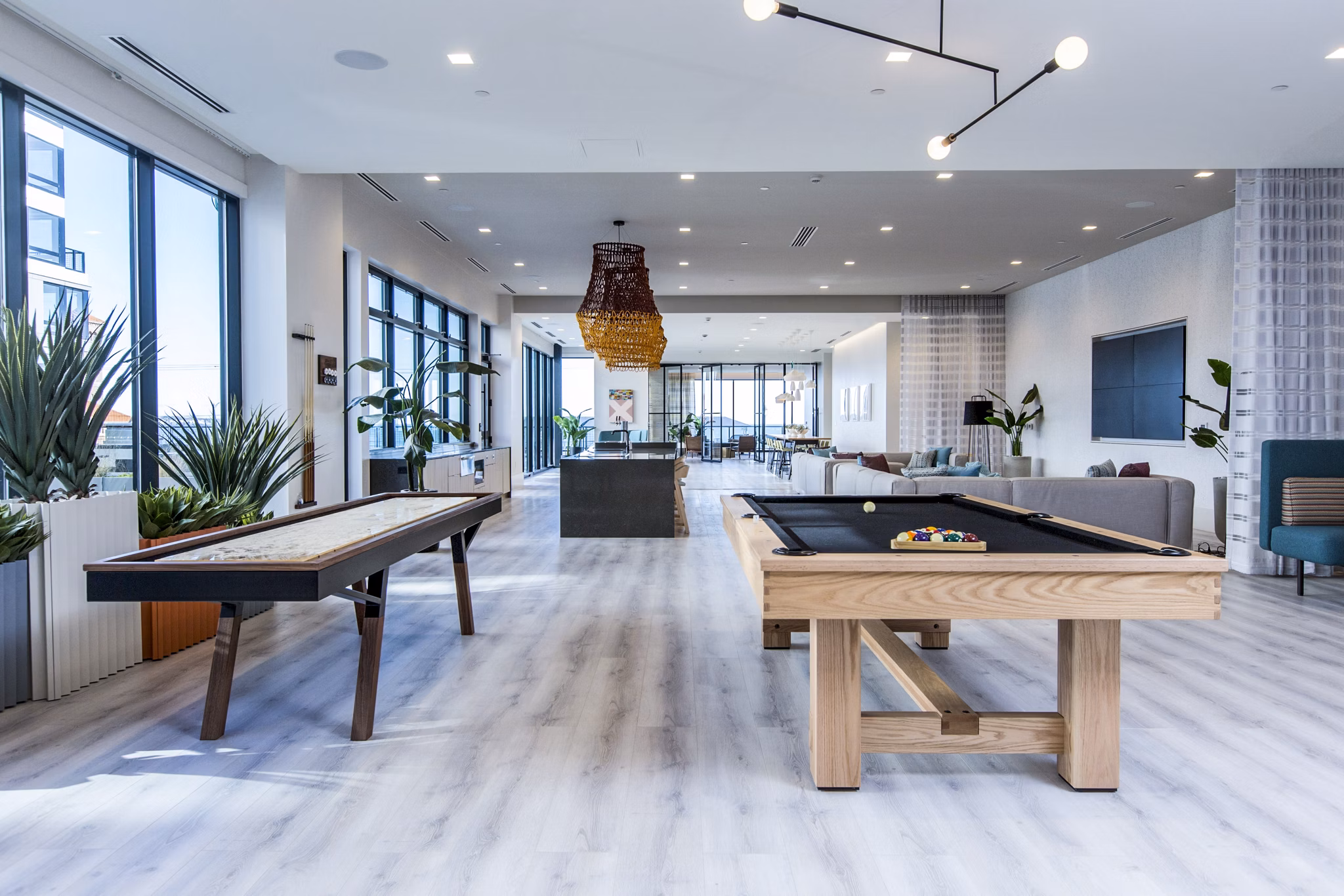 Game room with billiards and lounge area at 500 Ocean Ave Apartments