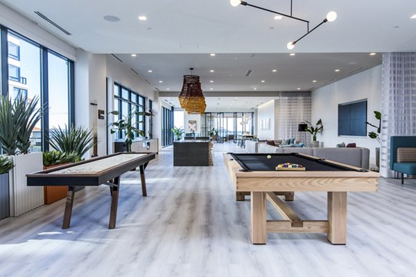 Game room with billiards and lounge area at 500 Ocean Ave Apartments
