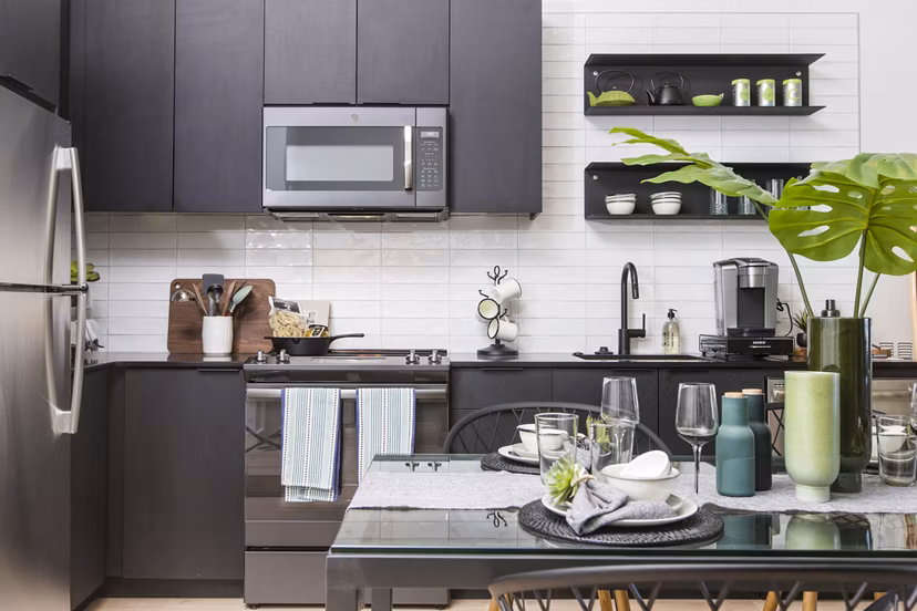 Contemporary kitchen with stainless steel appliances at 500 Ocean Ave Apartments
