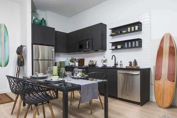 Modern kitchen with stainless steel appliances at 500 Ocean Ave Apartments