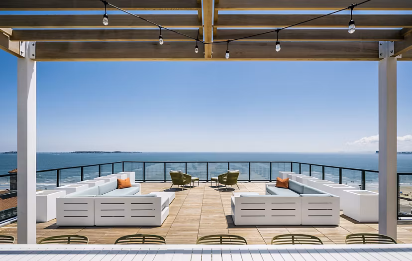 Cozy patio with ocean views at 500 Ocean Ave Apartments, ideal for relaxation and fresh air