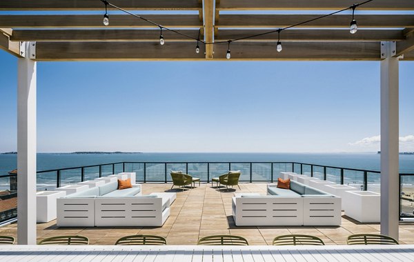 Cozy patio with ocean views at 500 Ocean Ave Apartments, ideal for relaxation and fresh air