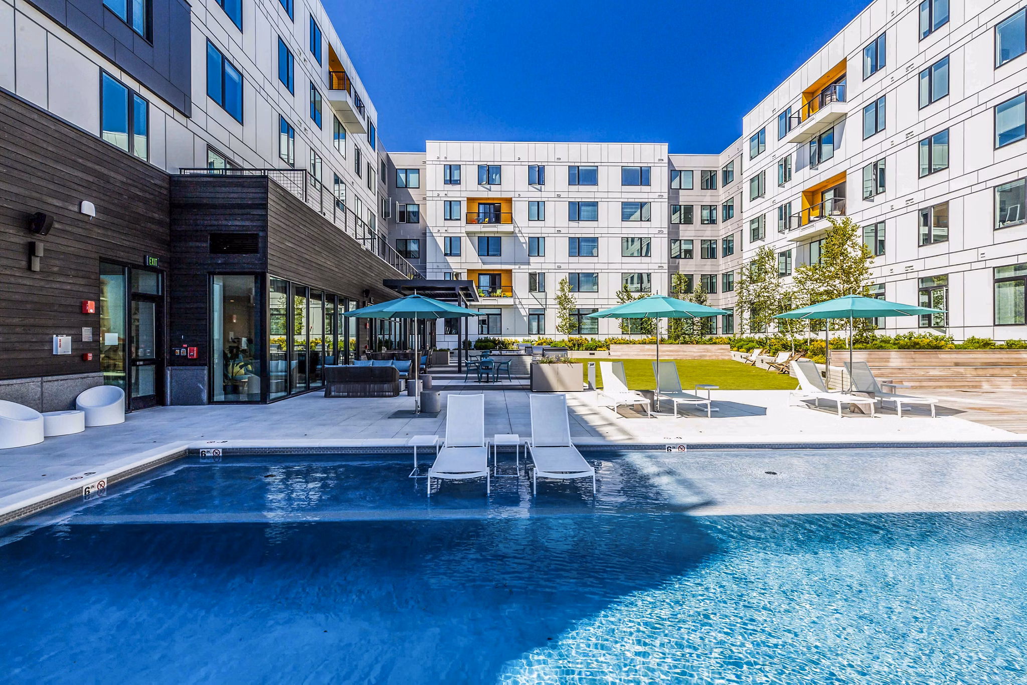 Modern rooftop pool with ocean views at 500 Ocean Ave Apartments, a luxury Greystar community