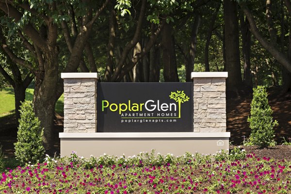 Poplar Glen Apartments: Signage on modern luxury property in vibrant community setting