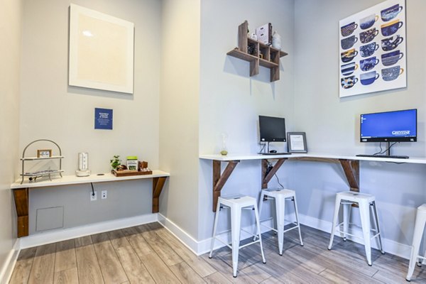 Modern clubhouse business center with sleek workstations at Poplar Glen, offering luxurious amenities for productive workspaces