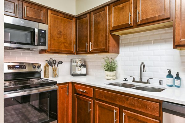Sleek kitchen with modern appliances in Poplar Glen Apartments