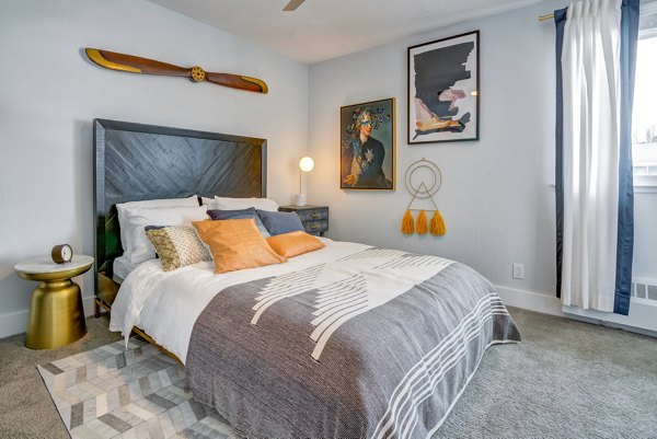 Bedroom featuring modern decor and natural lighting at Admirals Cove Apartments